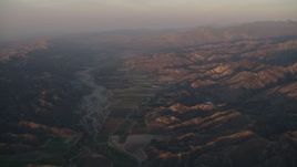 4K aerial stock footage Farmland by the Santa Clara River at sunrise, Piru, California Aerial Stock Footage | AX70_008