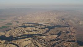 4K aerial stock footage Mountain ridges at sunrise, Cuyama, California Aerial Stock Footage | AX70_030
