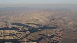 4K aerial stock footage Rugged mountain ridges at sunrise, Cuyama, California Aerial Stock Footage | AX70_032