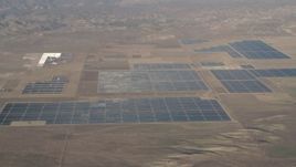 4K aerial stock footage Large solar panels at the Topaz Solar Farm in the Carrizo Plain, California Aerial Stock Footage | AX70_060