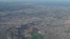 4K aerial stock footage of A view of farm fields around suburban neighborhoods in Salinas, California Aerial Stock Footage | AX70_086