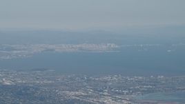 4K aerial stock footage San Francisco, the Bay Bridge, and San Francisco Bay seen from San Mateo, California Aerial Stock Footage | AX70_093