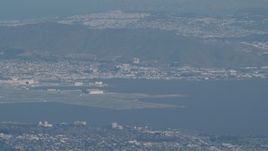 4K aerial stock footage Commercial jet flying by San Francisco International Airport in California Aerial Stock Footage | AX70_097