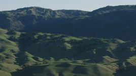 4K aerial stock footage Green hills and mountains in springtime, Gilroy, California Aerial Stock Footage | AX70_100
