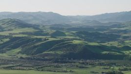 4K aerial stock footage Approach farms and green hills in Hollister, California Aerial Stock Footage | AX70_113