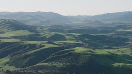 4K aerial stock footage Approaching green hills in Hollister, California Aerial Stock Footage | AX70_114