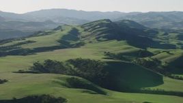 4K aerial stock footage An approach to green hills in Hollister, California Aerial Stock Footage | AX70_117