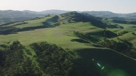 4K aerial stock footage Flying over green hills and trees in Hollister, California Aerial Stock Footage | AX70_118