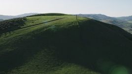 4K aerial stock footage Fly over hilltops in Hollister, California Aerial Stock Footage | AX70_130