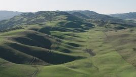 4K aerial stock footage Flying over green hills in Paicines, California Aerial Stock Footage | AX70_139
