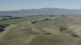 4K aerial stock footage Passing rolling green hills in San Benito County, California Aerial Stock Footage | AX70_165
