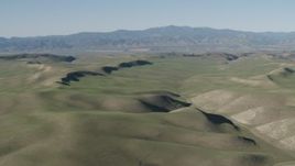 4K aerial stock footage Flyby rolling green hills, San Benito County, California Aerial Stock Footage | AX70_166
