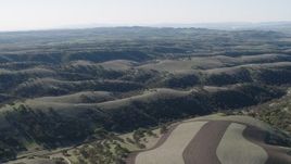 4K aerial stock footage Flying over green hills in San Benito County, California Aerial Stock Footage | AX70_174