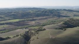 4K aerial stock footage Approach small farms and green hills in San Benito County, California Aerial Stock Footage | AX70_181