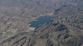 4K aerial stock footage of Santa Felicia Dam and Lake Piru in Los Padres National Forest, California Aerial Stock Footage | AX70_186