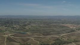 4K aerial stock footage Flyby rural homes, vineyards, and a pond in Paso Robles, California Aerial Stock Footage | AX70_225