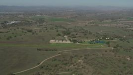 4K aerial stock footage small airfield beside an upscale home in Paso Robles, California Aerial Stock Footage | AX70_228