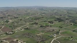 4K aerial stock footage Passing rural homes in San Miguel, California Aerial Stock Footage | AX70_230
