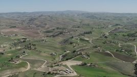 4K aerial stock footage Flying by rural homes in San Miguel, California Aerial Stock Footage | AX70_231