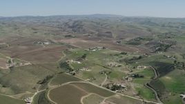 4K aerial stock footage Flying by rural homes and vineyards in San Miguel, California Aerial Stock Footage | AX70_232