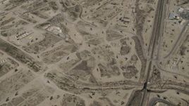 4K aerial stock footage Bird's eye of rigs in an oil field in San Ardo, California Aerial Stock Footage | AX70_238
