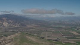 4K aerial stock footage Approach a cloud over farm fields in Greenfield, California Aerial Stock Footage | AX70_241