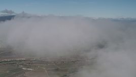4K aerial stock footage Fly through a cloud over farm fields in Greenfield, California Aerial Stock Footage | AX70_244