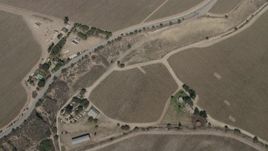 4K aerial stock footage bird's eye view of crop fields around Arroyo Seco Road in Greenfield, California Aerial Stock Footage | AX70_249
