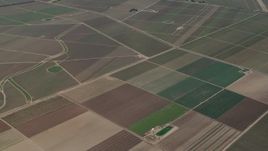 4K aerial stock footage Flyby crop fields by the intersection of Clark and Arroyo Seco Road in Soledad, California Aerial Stock Footage | AX70_252