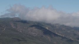 4K aerial stock footage Flyby low clouds over the Santa Lucia Range, California Aerial Stock Footage | AX70_254