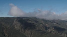 4K aerial stock footage Clouds on the summits of Santa Lucia Range mountains in California Aerial Stock Footage | AX70_258