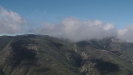 4K aerial stock footage Santa Lucia Range mountains capped by clouds in California Aerial Stock Footage | AX70_259