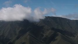 4K aerial stock footage of cloud beside a Santa Lucia Range mountain ridge in California Aerial Stock Footage | AX70_268