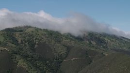 4K aerial stock footage of cloud cover over green mountains in the Santa Lucia Range in California Aerial Stock Footage | AX70_272