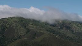 4K aerial stock footage of cloud-capped green mountains in the Santa Lucia Range in California Aerial Stock Footage | AX70_273