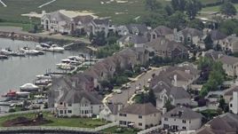 5.1K aerial stock footage flying by waterfront homes beside a canal, Seaford, Long Island, New York Aerial Stock Footage | AX71_006