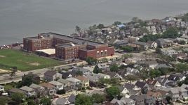 5.1K aerial stock footage of Lindell Elementary School beside Reynold's Channel in Long Beach, Long Island, New York Aerial Stock Footage | AX71_026