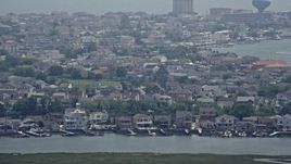 5.1K aerial stock footage of coastal neighborhoods with docks in Brigantine, New Jersey Aerial Stock Footage | AX71_159