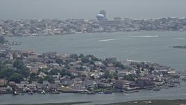 5.1K aerial stock footage of boats on a bay by coastal neighborhoods in Brigantine, New Jersey Aerial Stock Footage | AX71_160E
