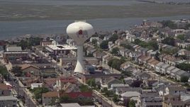 5.1K aerial stock footage of a water tower with Lucy the Margate Elephant, Margate City, New Jersey Aerial Stock Footage | AX71_212