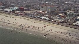 5.1K aerial stock footage of beach goers near Playland's Castaway Cove, Ocean City, New Jersey Aerial Stock Footage | AX71_221