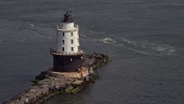 5.1K aerial stock footage flying by the Harbor of Refuge Light, Delaware Aerial Stock Footage | AX72_020E