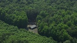 5.1K aerial stock footage of an isolated cabin in the woods in Milford, Delaware Aerial Stock Footage | AX72_053