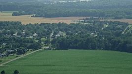 5.1K aerial stock footage of rural homes and fields in Frederica, Delaware Aerial Stock Footage | AX72_059