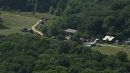 5.1K aerial stock footage of junk cars in Henderson, Maryland Aerial Stock Footage | AX72_094