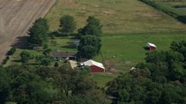 5.1K aerial stock footage of a ranch house and barns with horses in Henderson, Maryland Aerial Stock Footage | AX72_098