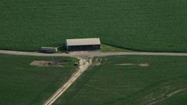 5.1K aerial stock footage of a barn next to a crop field in Ingleside, Maryland Aerial Stock Footage | AX72_102