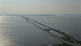 5.1K aerial stock footage flying by Chesapeake Bay Bridge spanning the bay in Maryland Aerial Stock Footage | AX73_001