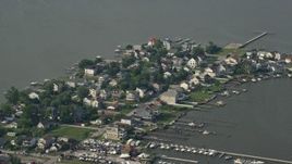 5.1K aerial stock footage of waterfront homes and boats at a small marina in Hawk Cove at Sparrows Point, Maryland Aerial Stock Footage | AX73_042E