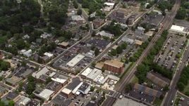 4.8K aerial stock footage flying over water tower, shops and streets in Manassas, Virginia Aerial Stock Footage | AX74_004